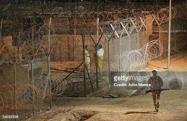 Army military police officer patrols secure prisoner areas in the Abu Ghraib Prison October 27, 2005 which is located on the outskirts of Baghdad,...