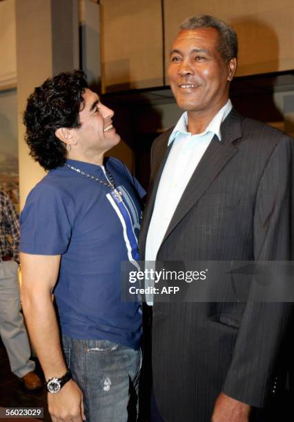 Argentinian ex soccer star Diego Armando Maradona speaks with Cuban boxer Teofilo Stevenson, triple Olympic Gold medalist during the recording of...
