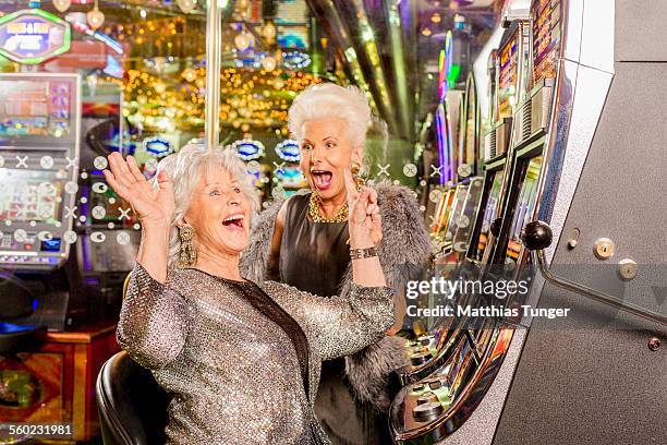 cheering ladies in a casino - casino stockfoto's en -beelden
