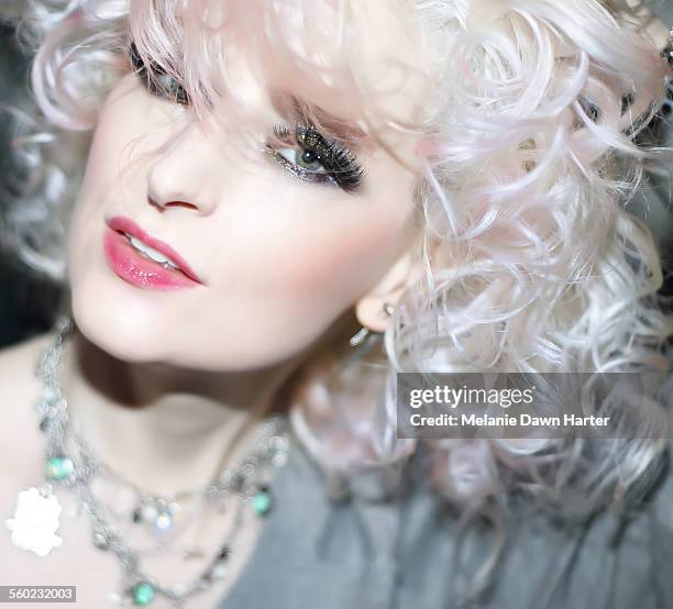 curly platinum blonde woman - platinum blonde hair stock pictures, royalty-free photos & images