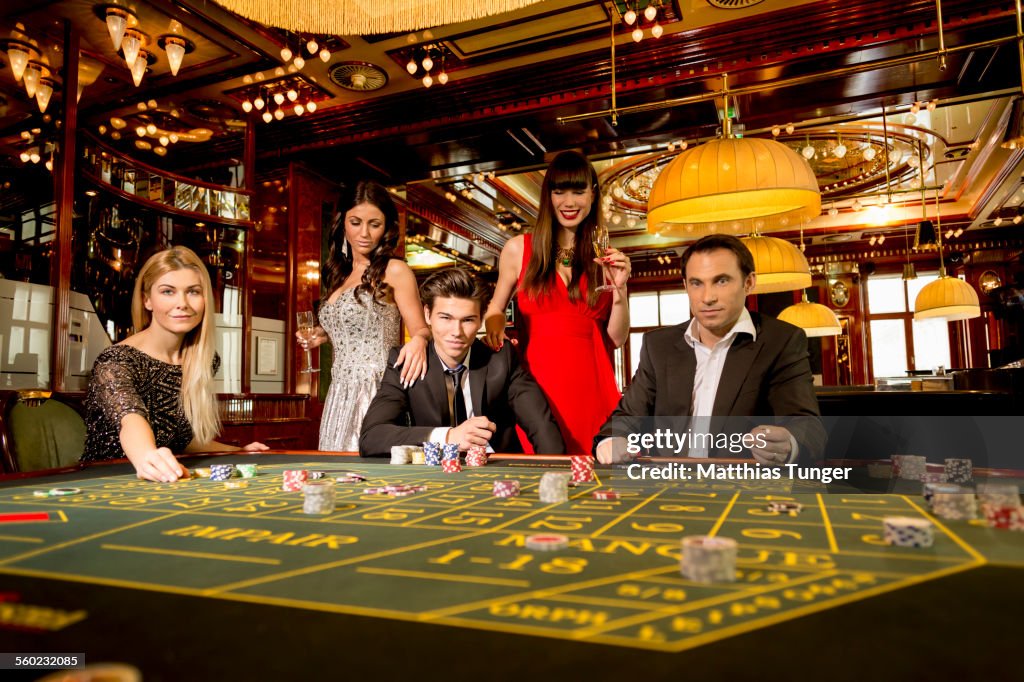 People playing roulette in a casino