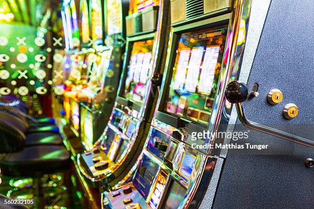 slot machines in a casino - casino stock pictures, royalty-free photos & images