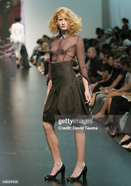 Model walks down the catwalk wearing a Onefell Swoop design during the New Generation show at Mercedes Australian Fashion Week at Federation Square...