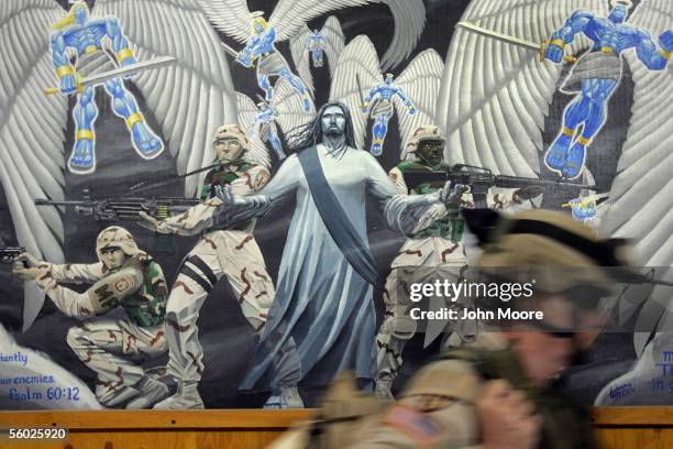 Army military policeman prepares to start his 12-hour shift guarding suspected insurgents after a briefing held in the chapel of the Abu Ghraib...