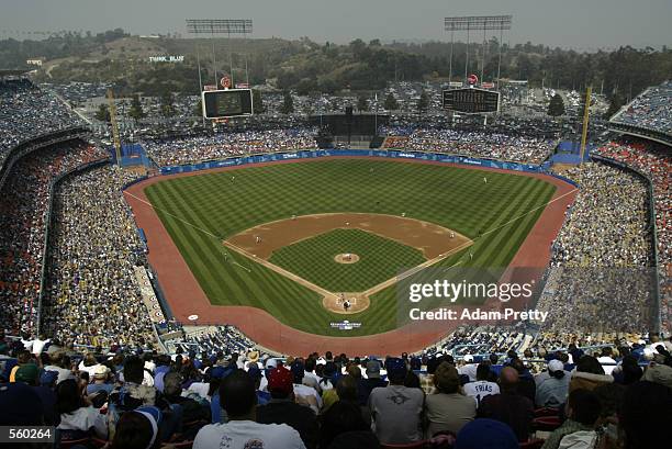 Starting pitcher Kevin Brown of the Los Angeles Dodgers delivers the first pitch to Tsuyoshi Shinjo of the San Francisco Giants on Opening Day at...