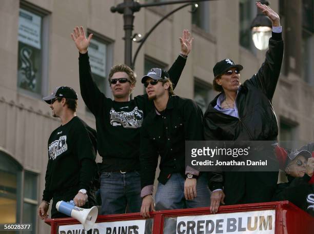 Aaron Rowand, Geoff Blum, Joe Crede and announcer Ed Farmer of the Chicago White Sox wave to the crowd at the White Sox victory parade and rally on...