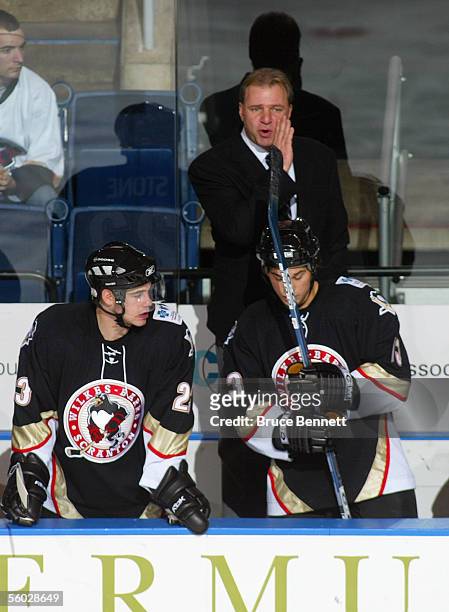 Head Coach Michel Therrien of the Wilkes-Barre/Scranton Penguins looks on from the bench during their game against the Bridgeport Sound Tigers at...