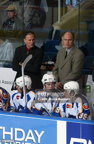 Head Coach Dave Baseggio and Assistant Coach Pat Bingham of the Bridgeport Sound Tigers look on from the bench during their game against the...