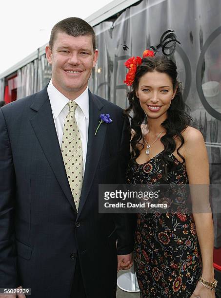 Businessman James Packer and partner Erika Baxter pose during the AAMI Victorian Derby Day at Flemington on October 29, 2005 in Melbourne, Australia.