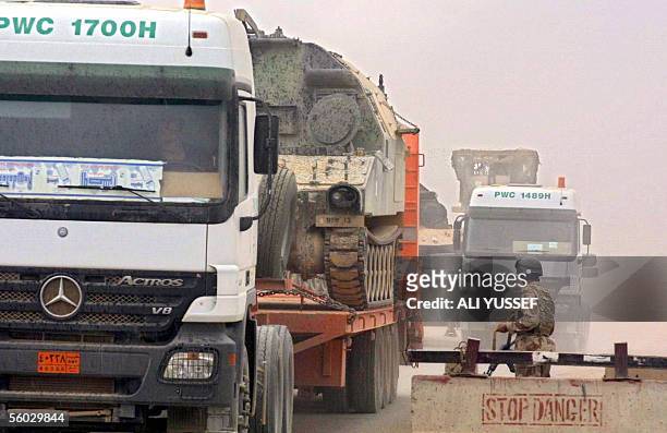 Military convoy drives past an Iraqi army checkpoint just outside Kirkush military base, 100 kms east of Baghdad they conclude their mission 29...