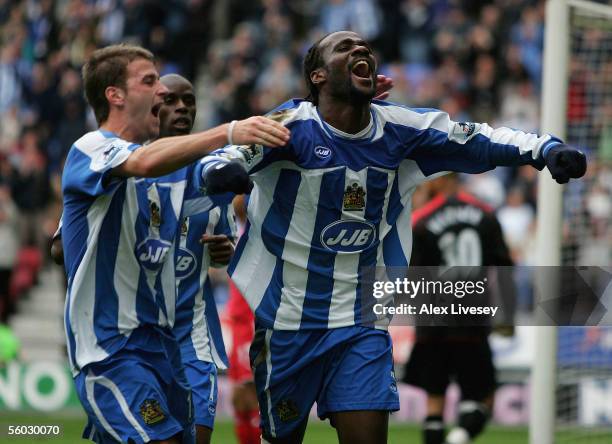 Pascal Chimbonda of Wigan Athletic celebrates his match winning goal with Ryan Taylor during the Barclays Premiership match between Wigan Athletic...