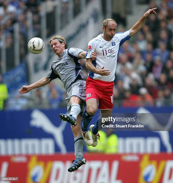 Christian Poulson of Schalke challenges Sergej Barbarez of Hamburg during the Bundesliga match between Hamburger SV and Schalke 04 at the AOL Arena...