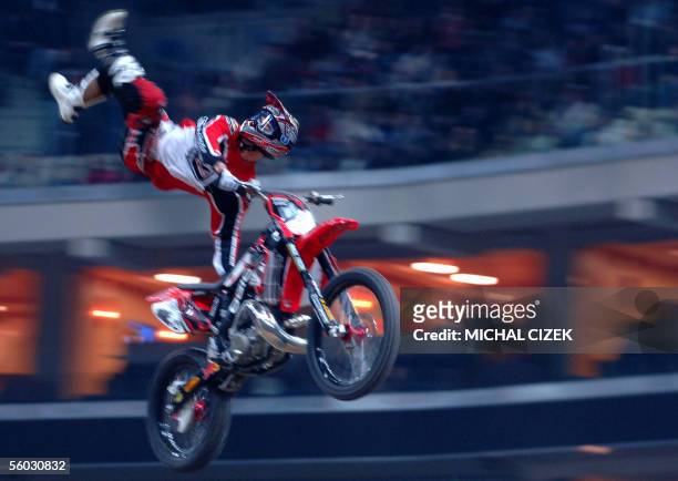 Prague, CZECH REPUBLIC: An unidentified freestyle biker, with face hidden, performs in Sazka Arena during the Monster Jam freestyle motocross extrem...