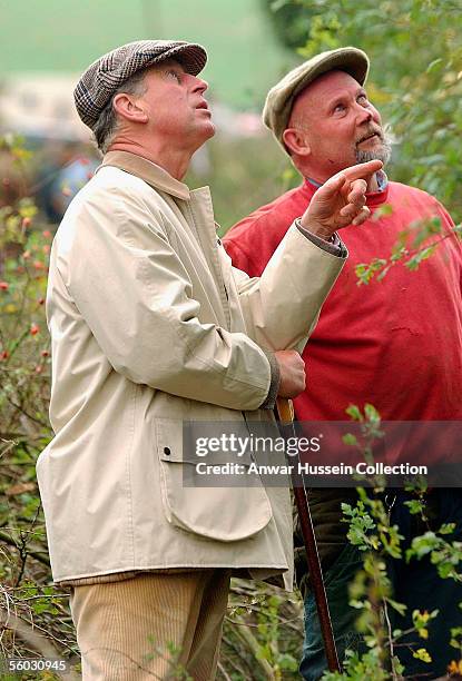 Prince Charles, Prince of Wales talks to a participant during the National Hedge Laying Championships at Home Farm on October 29, 2005 in Tetbury,...