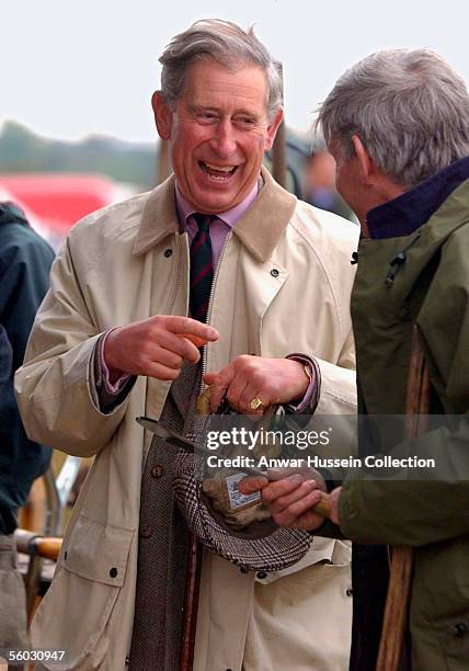 Prince Charles, Prince of Wales speaks to participants during the National Hedge Laying Championships at Home Farm on October 29, 2005 in Tetbury,...