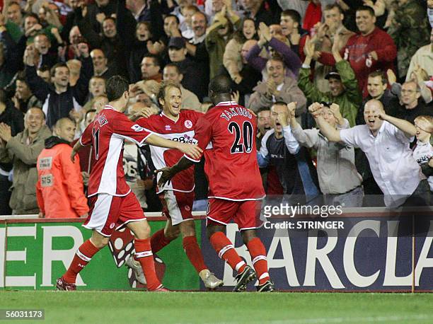 Middlesborough, UNITED KINGDOM: Middlesbrough's Stuart Parnaby, Gaizka Mendieta and Yakubu celebrate the fourth goal against Manchester United during...
