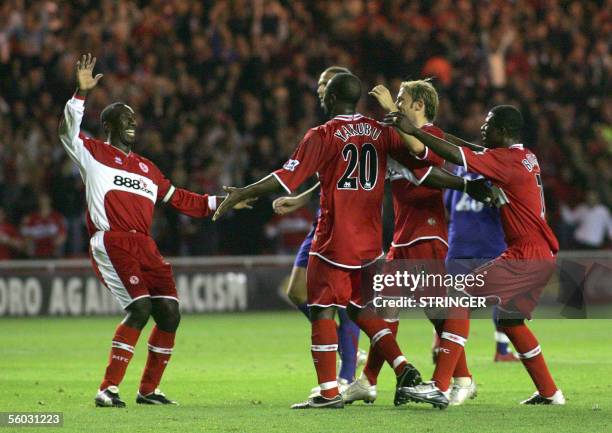 Middlesborough, UNITED KINGDOM: Middlesbrough's Jimmy Floyd Hasselbaink, Yakubu , Gaizka Mendieta and George Boateng celebrate the third goal during...