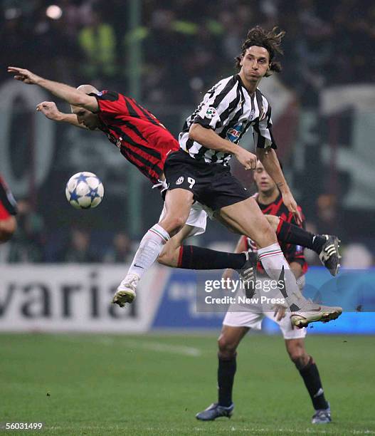 Jaap Stam of AC Milan and Zlatan Ibrahimovic of Juventus in action during the Serie A match between AC Milan and Juventus at the Giuseppe Meazza, San...