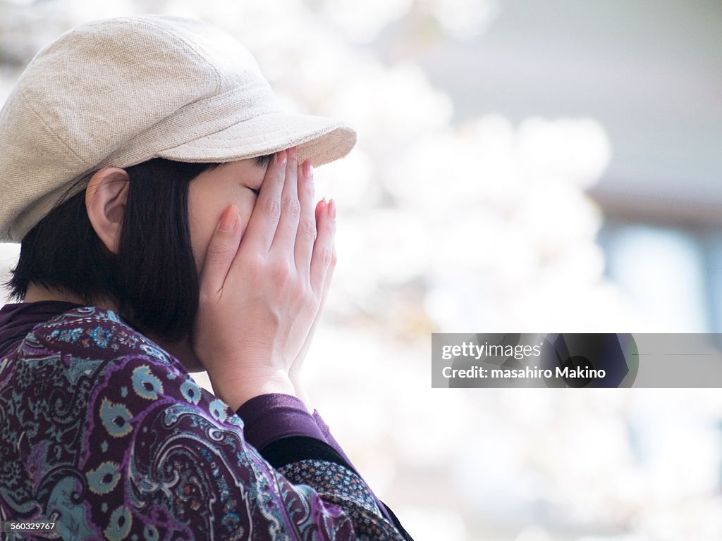 Woman Burying Her Face in Her Hands