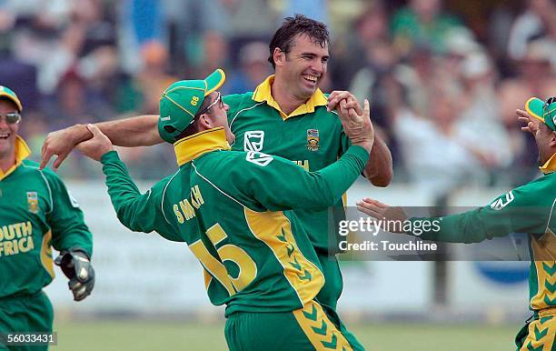 Justin Kemp of South Africa celebrates running out Stephen Flemming of New Zealand during the Third One Day International between South Africa and...