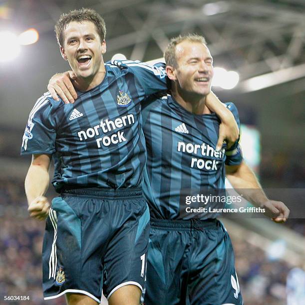 Alan Shearer of Newcastle United is congratulated on his goal by Michael Owen during the Barclays Premiership match between West Bromwich Albion and...