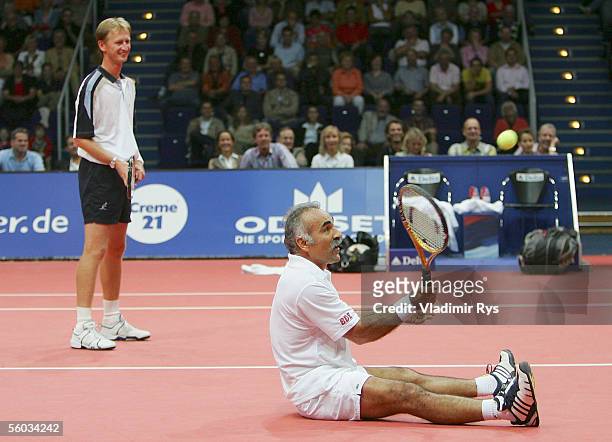 Mansour Bahrami plays the ball sitting on the ground as his partner Petr Korda looks on during the final of the doubles of the Deichmann Champions...