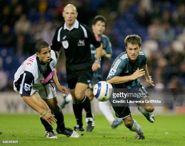 Michael Owen of Newcastle United battles for the ball with Curtis Davies of West Brom during the Barclays Premiership match between West Bromwich...