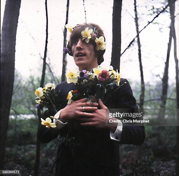 English singer Roger Daltrey of rock band The Who, posing with spring flowers in his hair during a tour in Germany, circa 1967.