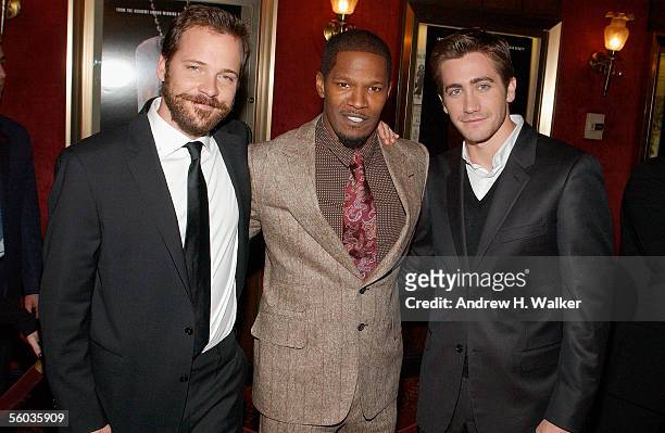 Actors Peter Sarsgaard, Jamie Foxx and Jake Gyllenhaal attend the Universal Pictures Premiere of "Jarhead" on October 30, 2005 in New York City.