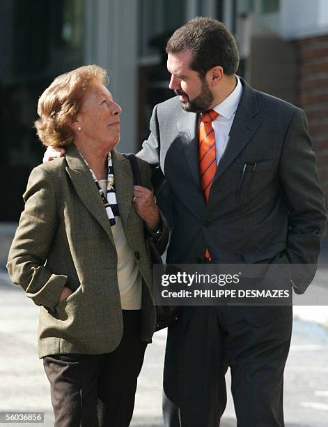 Spain's Princess Letizia's grandmother Menchu Alvarez and Letizia's father Jesus Ortiz smile after paying a visit to see Letizia at the Ruber clinic...