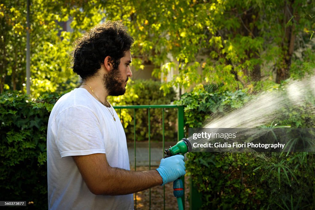 Man watering a garden