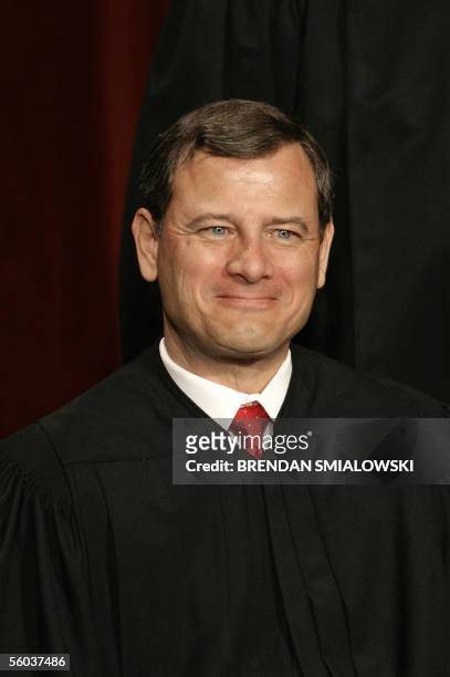 Washington, UNITED STATES: US Supreme Court Chief Justice John Roberts Jr. Sits for a class photo at the Supreme Court 31 October 2005 in Washington....