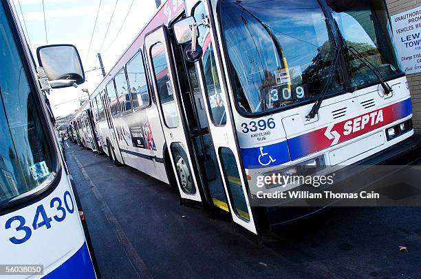 Buses sit idle at SEPTA's Frankford Transportation Center as members of Transport Workers Union Local 234 and United Transportation Union Local 1594...