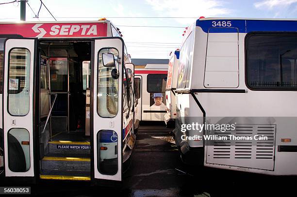 Buses sit idle at SEPTA's Frankford Transportation Center as members of Transport Workers Union Local 234 and United Transportation Union Local 1594...