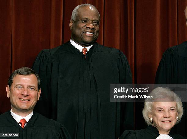 Chief Justice John G. Roberts Justice Clarence Thomas and Justice Sandra Day O'Connor pose for photographers at the U.S. Supreme Court October 31,...