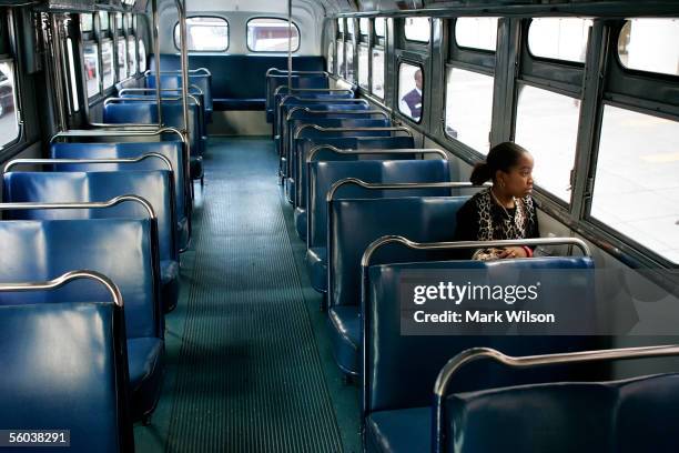 Ten-year-old Mishaew Washington of Hyattsville, Maryland sits in a vintage 50's era bus in front of the Metropolitan AME Church during a memorial...