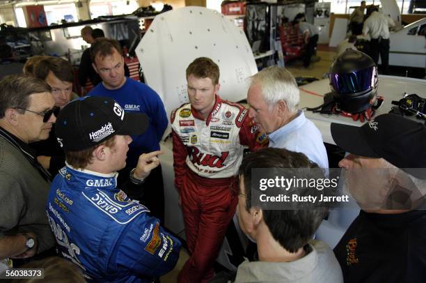 Hendricks Motorsports driver Brian Vickers exchanges information with DEI driver Dale Earnhardt Jr. And NASCAR VP of research and development Gary...