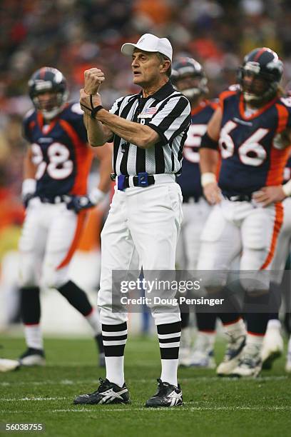 Referee Bernie Kukar calls a holding penalty during the Philadelphia Eagles game against the Denver Broncos at INVESCO Field at Mile High on October...