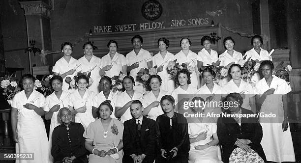 Teacher and students of the Madame CJ Walker beauty school at a school, Washington DC, June 5, 1937.