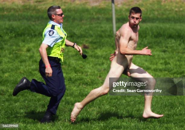 Streaker runs onto the track after the running of the Melbourne Cup at Flemington Racecourse November 1, 2005 in Melbourne, Australia.