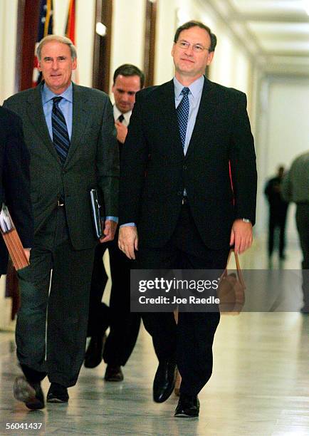 Samuel A. Alito walks former Sen. Dan Coats to a meeting with Senator Tim Johnson November 1, 2005 on Capitol Hill in Washington, DC. President...