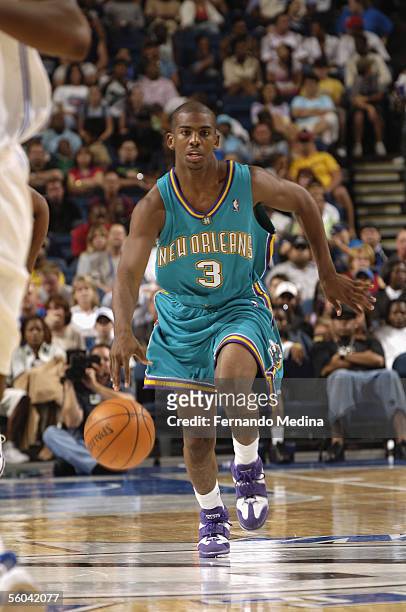 Chris Paul of the New Orleans/Oklahoma City Hornets brings the ball upcourt during the preseason game against the Orlando Magic at the St. Pete Times...