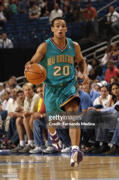 Alex Garcia of the New Orleans/Oklahoma City Hornets moves the ball upcourt during the preseason game against the Orlando Magic at the St. Pete Times...