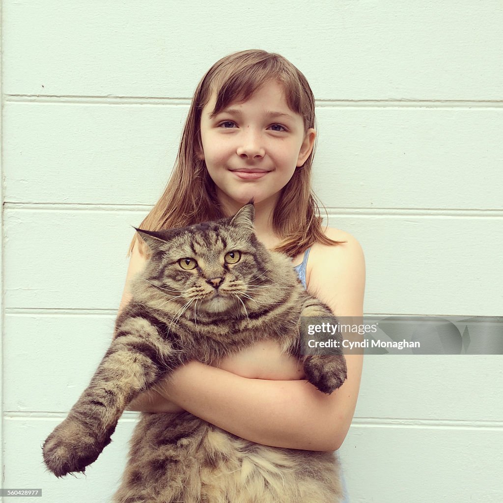 Girl Hugging Cat