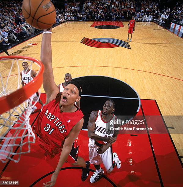 Charlie Villanueva of the Toronto Raptors takes the ball to the basket during a preseason game against the Portland Trail Blazers at The Rose Garden...