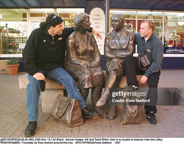 All Black Aarron Hoppa, left and Todd Miller chat to a couple of statues near the Liffey River in Dublin, Thursday as they looked around the city.