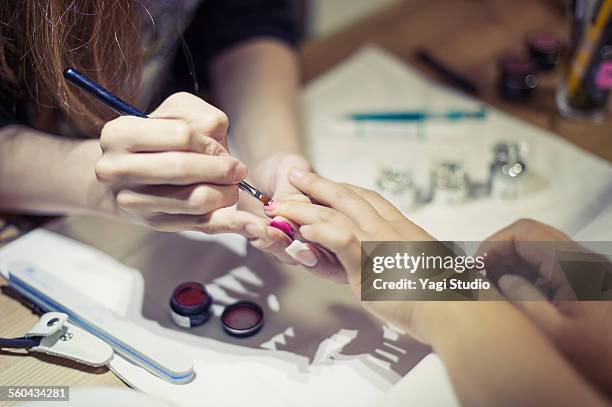 manicure treatment at nail shop - manicure stockfoto's en -beelden