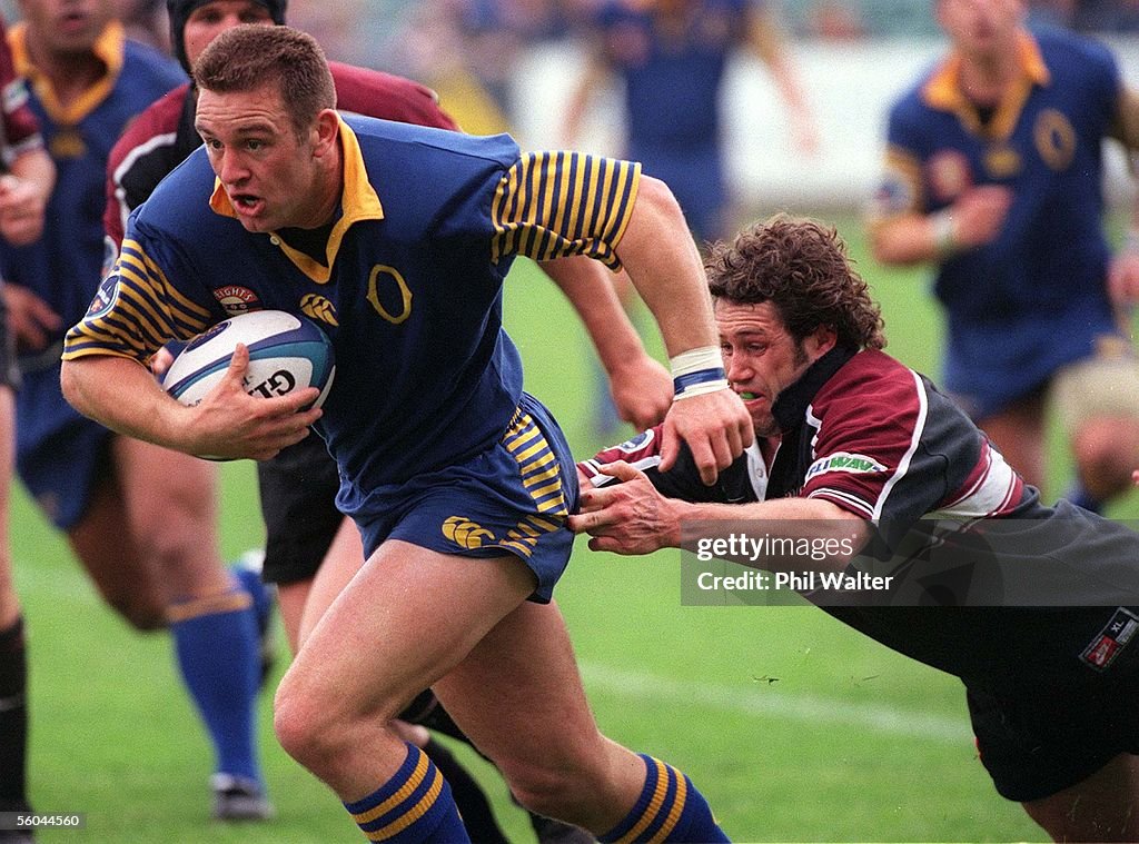 Otago's Brendan Laney makes a break with Nth Harbo