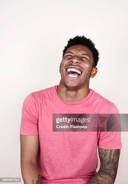 portrait of man laughing - laughing stock pictures, royalty-free photos & images