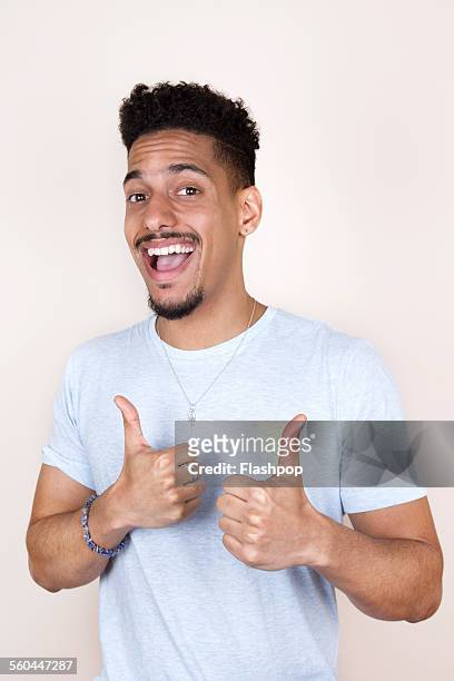 man smiling giving a thumbs up - 親指を立てる ストックフォトと画像